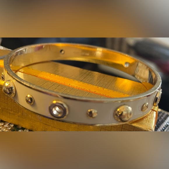 Coach Jewelry - Coach Gold Metal Bangle Bracelet with Screw Stud Details